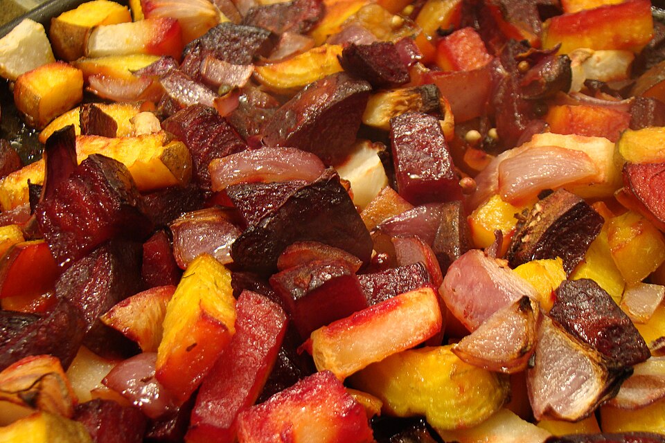 Roasted beet wedges served over a swirl of mint yogurt with herbs on top